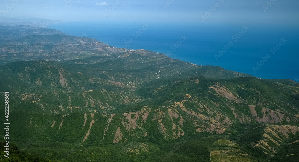 View of the Black Sea coast from the valley of the Demerdzhi mountain range in Crimea.