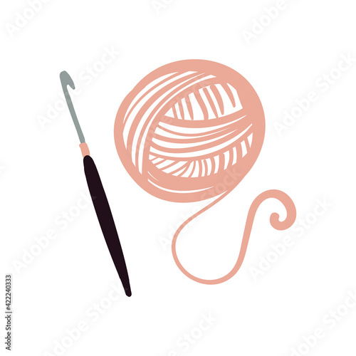 
crochet hook and ball of thread on the white background