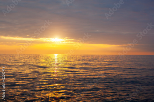 Amazing beach sunset with endless horizon. Horizontal. Selective focus. © Anna