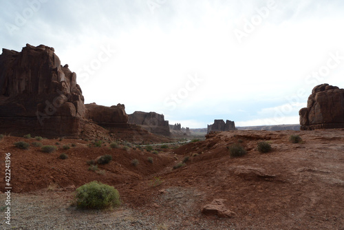 Moody view of the red sandstone formations at Arches National Park in Utah on a cloudy and stormy day