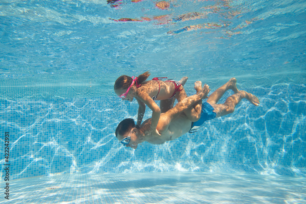 family in swimming pool