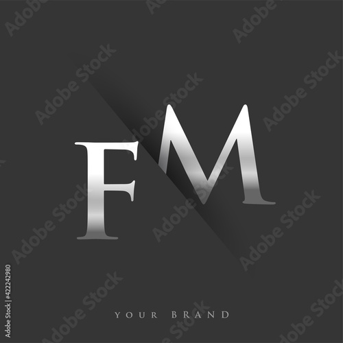 initial logo letter FM for company name, silver color and slash design in black background. vector logotype for business and company identity.