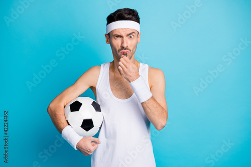 Photo of angry soccer player hold ball blow whistle wear white tank-top isolated over blue color background © deagreez