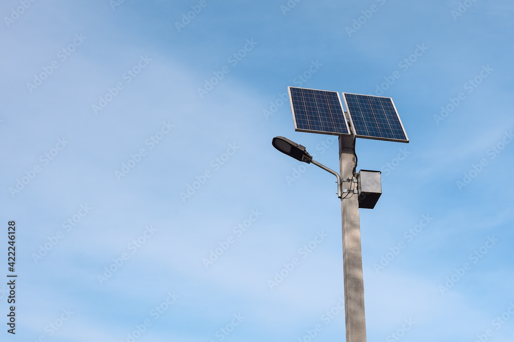 solar panel on a lamppost against the blue sky on a bright sunny day. Street lighting with solar panels. copy space solar panel on a lamppost against the blue sky on a bright sunny day. Street lighting with solar panels. copy space