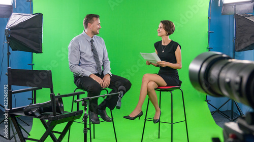 Recording interview with politician using professional tv green screen studio photo