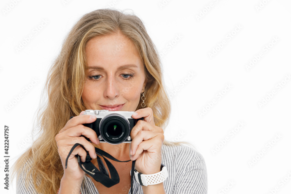Positive portrait of happy young woman making photo. Lifestyle concept on white background.