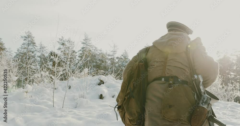 4K Re-enactor Dressed As German Wehrmacht Infantry Soldier In World War II Walking With Weapon In Winter Snowy Forest 4K Re-enactor Dressed As German Wehrmacht Infantry Soldier In World War II Walking With Weapon In Winter Snowy Forest