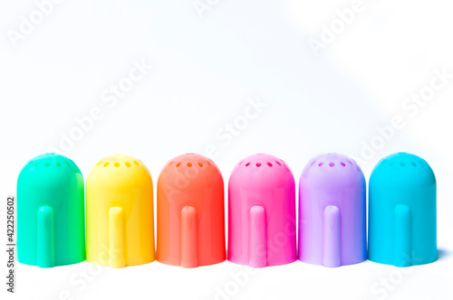 Colored domes for carioca, six caps on white background. Copy, text space.