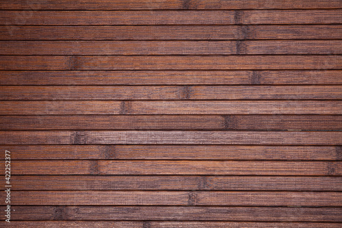 Natural dark brown wooden background, top view of wood planks backdrop