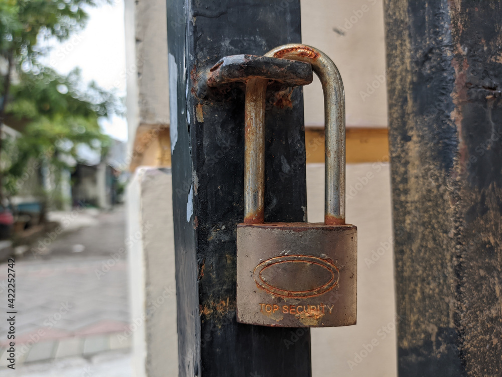 A rusty padlock with the words A rusty padlock with the words