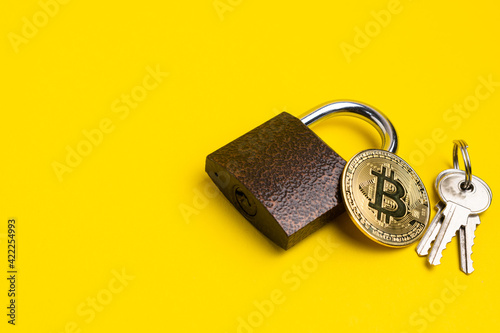 Cryptocurrency security symbol. Bitcoin in front of the lock.