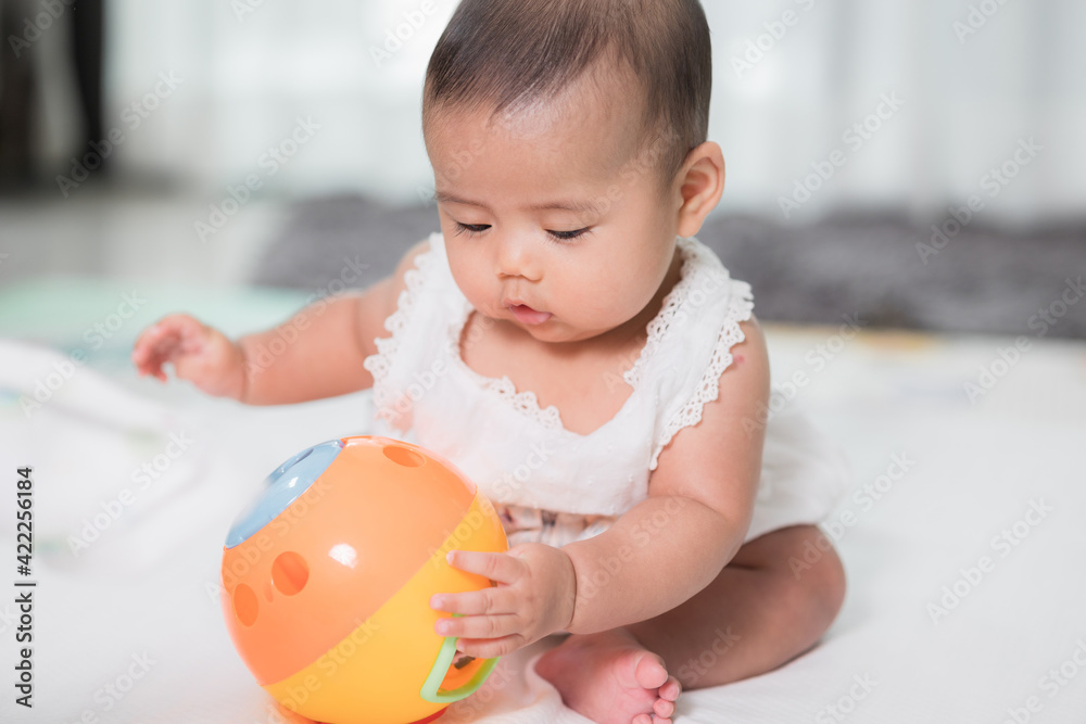 Asian baby cute in the living room at home playing ball toy with family. Asian baby cute in the living room at home playing ball toy with family.