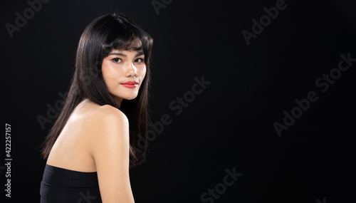 Fashion Beauty Woman has long straight black hair looks at camera