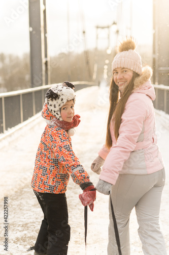 Wallpaper Mural Happy family walking on snowy bridge in winter weather Torontodigital.ca