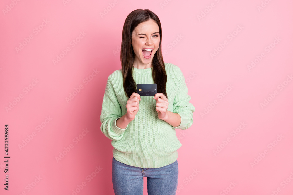 Photo of flirty sweet brunette girl show card blink wear lime shirt jeans isolated on pink color background Photo of flirty sweet brunette girl show card blink wear lime shirt jeans isolated on pink color background