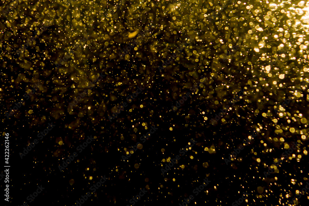 Gold bokeh of lights from water Gold bokeh of lights from water