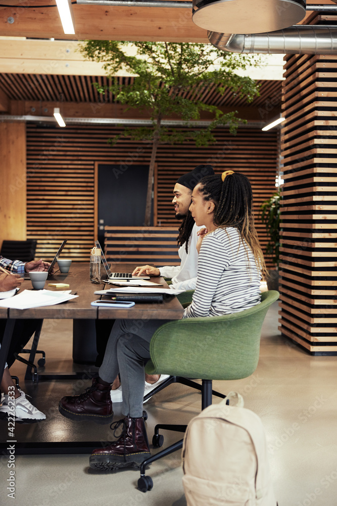 Young businesspeople working at an office table