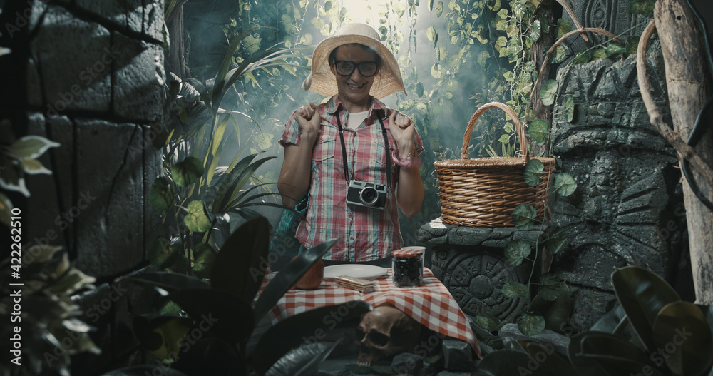 Happy tourist having a picnic in the jungle