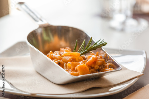 Pasta e fagioli napoletana con rosmarino servita in un piatto particolare  photo