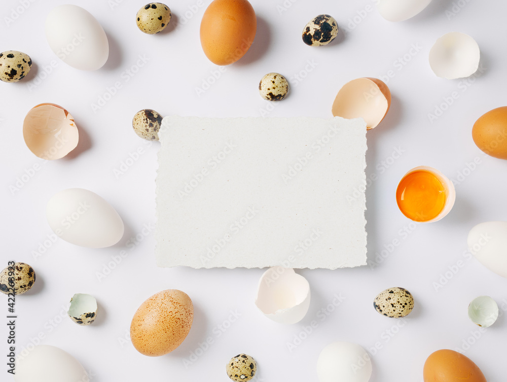 Easter message. Natural and white color eggs on bright white background in Happy Easter decoration. Minimal egg design, modern flat lay template. Easter message. Natural and white color eggs on bright white background in Happy Easter decoration. Minimal egg design, modern flat lay template.