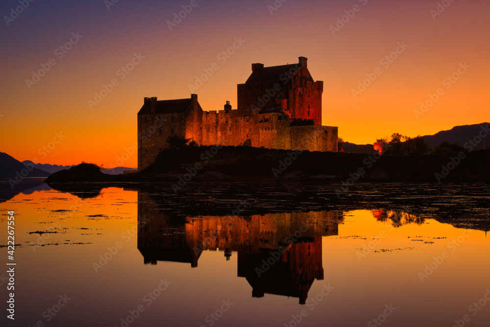 Eilean donan castle, scotland at golden hour sunset