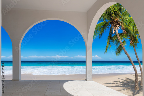Fototapeta Naklejka Na Ścianę i Meble -  Tropical beach resort with palm trees, white sand and Caribbean sea. Summer vacation and tropical beach concept.	