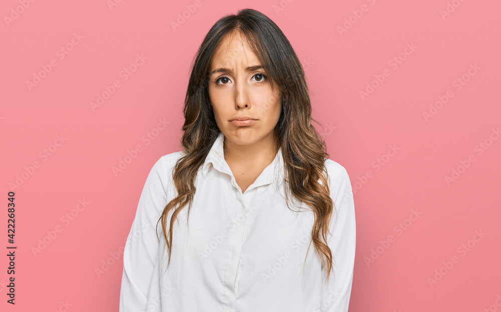 Young brunette woman wearing casual clothes depressed and worry for distress, crying angry and afraid. sad expression.