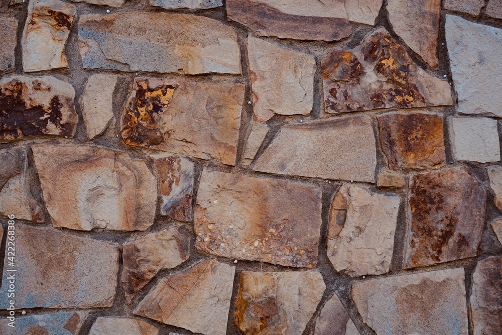red stone building wall, textured abstract background red stone building wall, textured abstract background