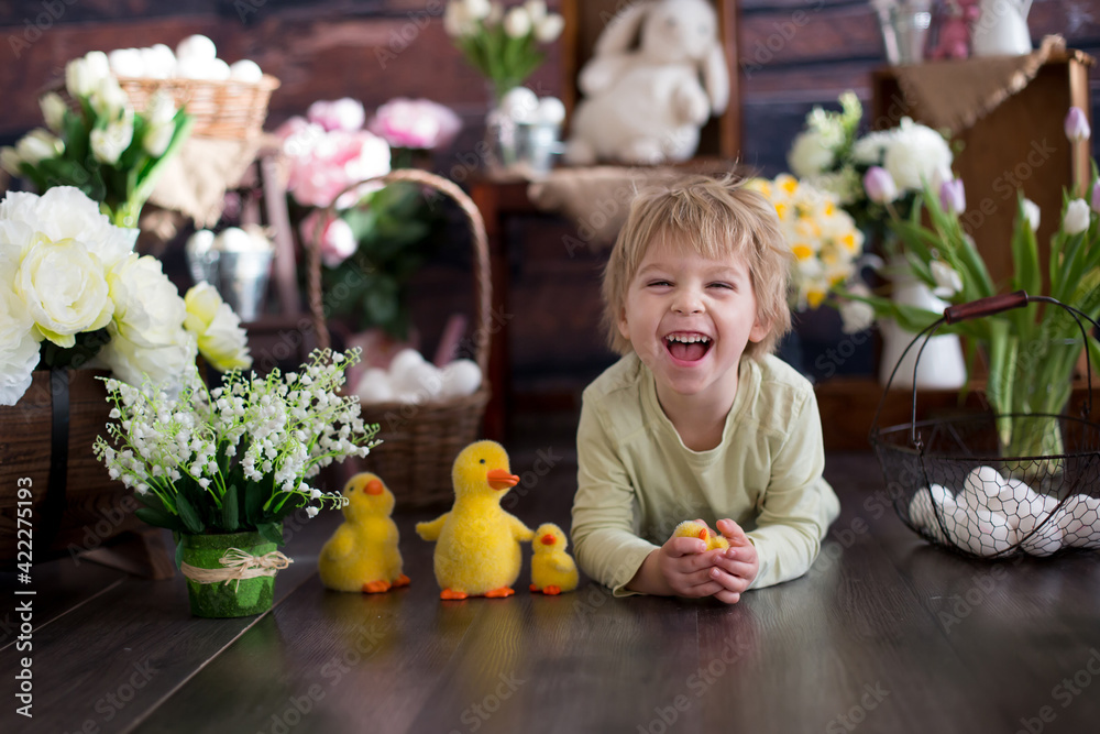 Fototapeta premium Cute toddler blond child, boy with easter decoration