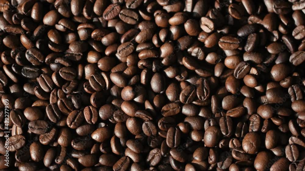 Roasted vietnamese coffee bean. Fragrant coffee beans scrolls slowly around the camera. Slow Motion Close Up of Whole Roasted Coffee Beans.High angle view. 4k resolution Roasted vietnamese coffee bean. Fragrant coffee beans scrolls slowly around the camera. Slow Motion Close Up of Whole Roasted Coffee Beans.High angle view. 4k resolution