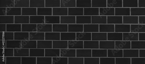 Panorama of Vintage black brick tile wall pattern and background seamless
