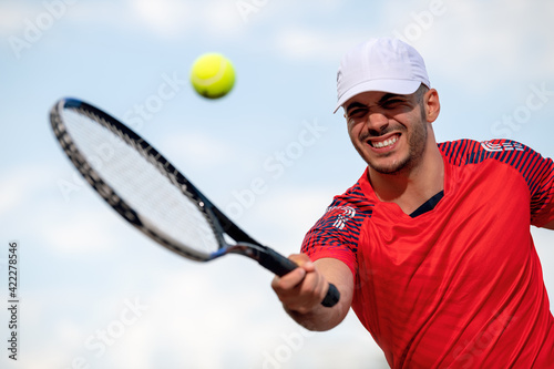 Young tennis player playing tennis © ivanko80