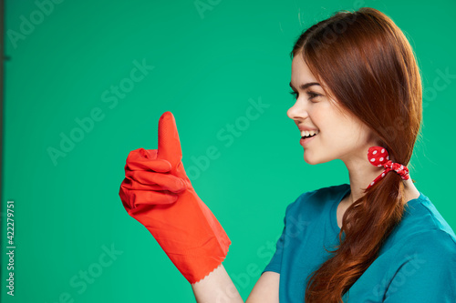 cleaning lady wearing rubber gloves cleaning supplies professional housework