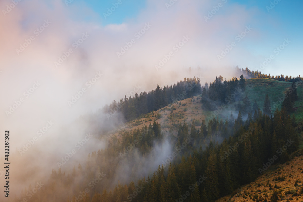 Panoramic view of the misty mountains in the countryside.