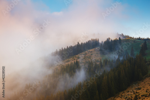 Panoramic view of the misty mountains in the countryside. © Leonid Tit