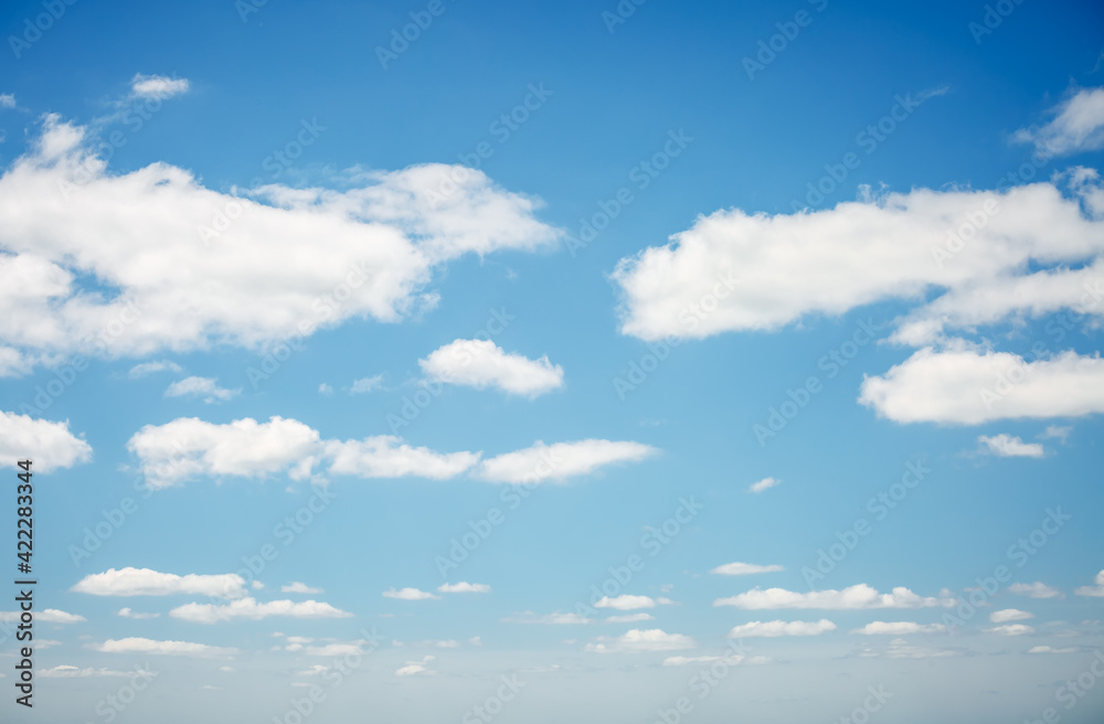 Azure sky background with white fluffy clouds in the fresh sunny day. Azure sky background with white fluffy clouds in the fresh sunny day.