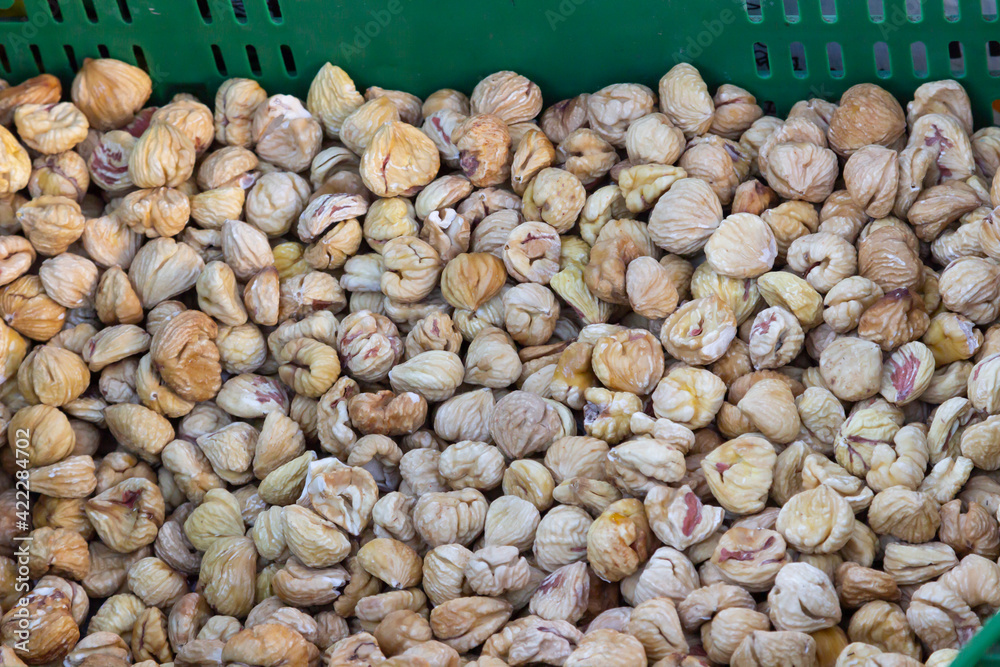 Close-up and background of many dried chestnuts as preserved dried fruits for eating for sell in the market Close-up and background of many dried chestnuts as preserved dried fruits for eating for sell in the market