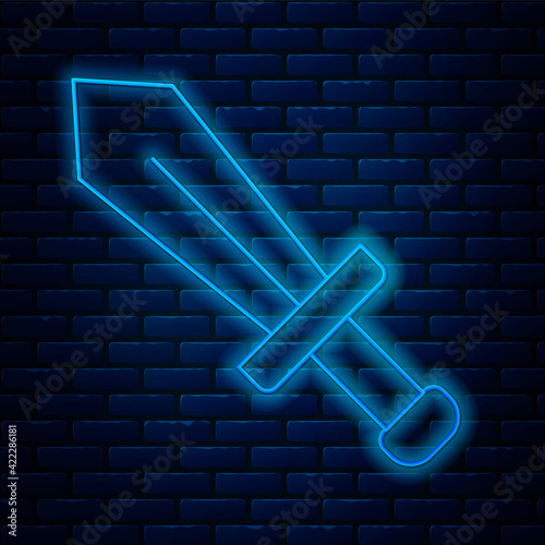 Glowing neon line Sword for game icon isolated on brick wall background. Vector