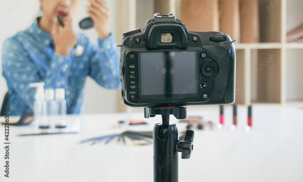 Professional Woman blogger vlogger is showing cosmetics products with recording video makeup artist applies blush powder and working with beautiful asian woman video online marketing Professional Woman blogger vlogger is showing cosmetics products with recording video makeup artist applies blush powder and working with beautiful asian woman video online marketing