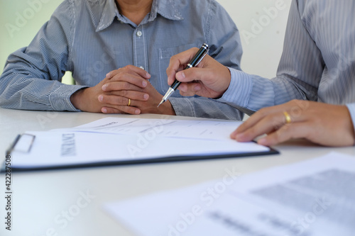 Business people signing contract making a deal with real estate agent Concept for consultant and home insurance concept.