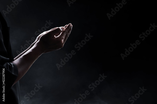 Hands of muslim man praying