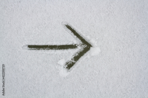 Arrow symbol in the snow.