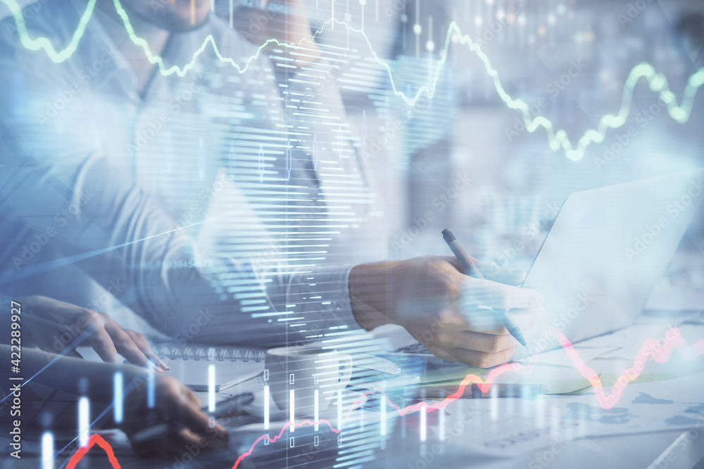 Multi exposure of man and woman working together and financial chart hologram. Business concept. Computer background. Multi exposure of man and woman working together and financial chart hologram. Business concept. Computer background.