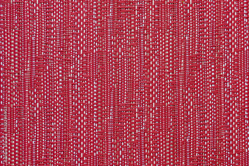 Red and white linen fabric texture background. Closeup of red textile material as texture or background. Magenta artificial rough cloth texture