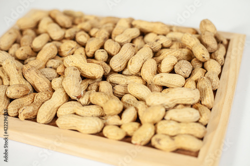 peanuts on a wooden tray