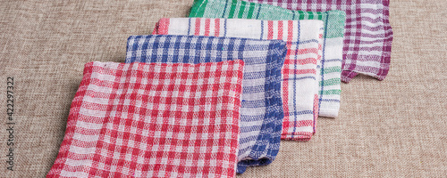 Foto Set of handkerchiefs on a cloth background
