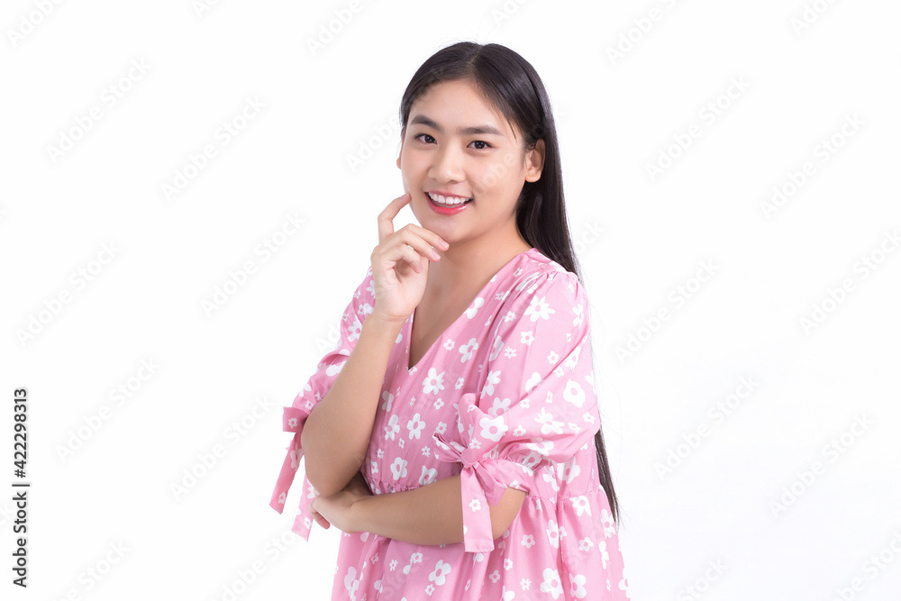 Portrait Asian beautiful woman in pink dress and black long hair. Her hands touch cheek, smile, show beautiful skin on white background. Portrait Asian beautiful woman in pink dress and black long hair. Her hands touch cheek, smile, show beautiful skin on white background.