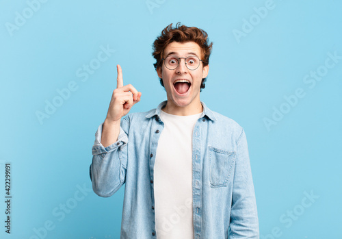 Schilderij op canvas young handsome boy feeling like a happy and excited genius after realizing an id