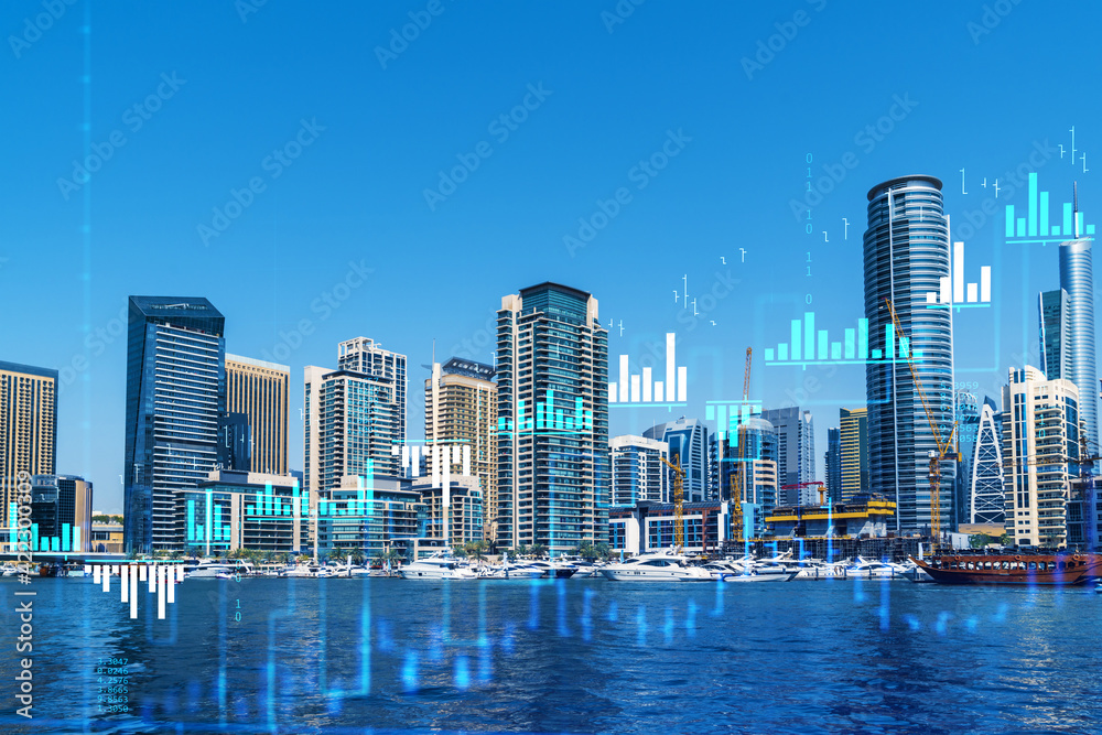 Fototapeta premium Skyscrapers of Dubai business downtown. International hub of trading and financial services of Western Asia. FOREX graph and chart concept. Double exposure. Dubai Canal waterfront.