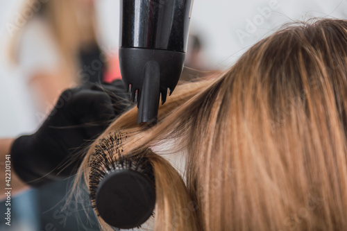 closeup of hairdresser doing her client's hair